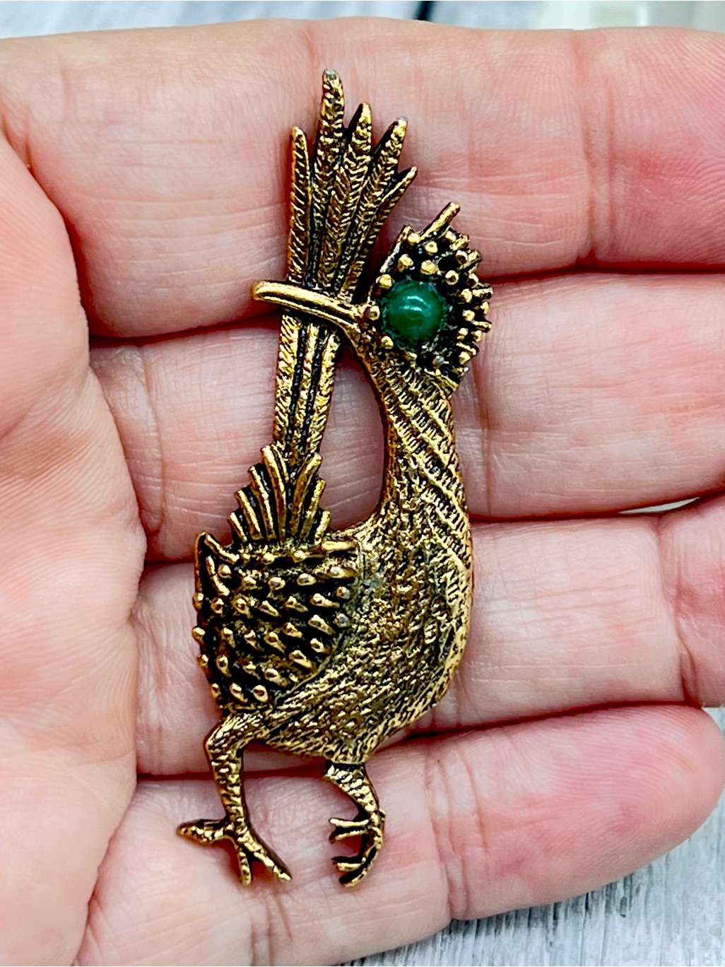 333. Vintage Antique Gold-Tone Roadrunner Brooch With Green Cabochon